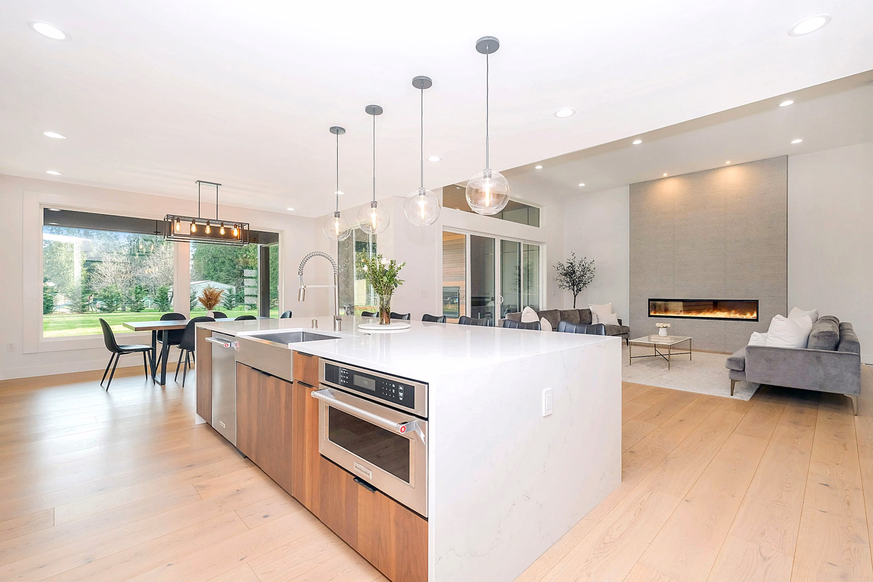 Walnut island with a white waterfall countertop