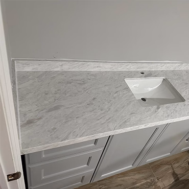 Marble-look vanity top with an undermount sink installed by Sunsai