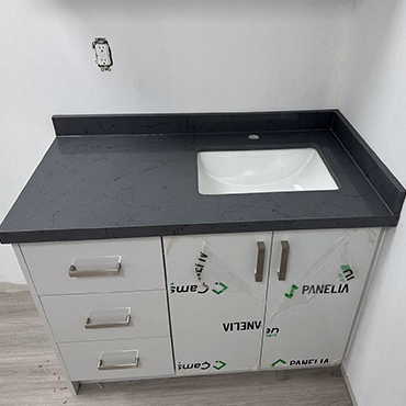 Charcoal vanity top with an undermount sink and drawer vanity